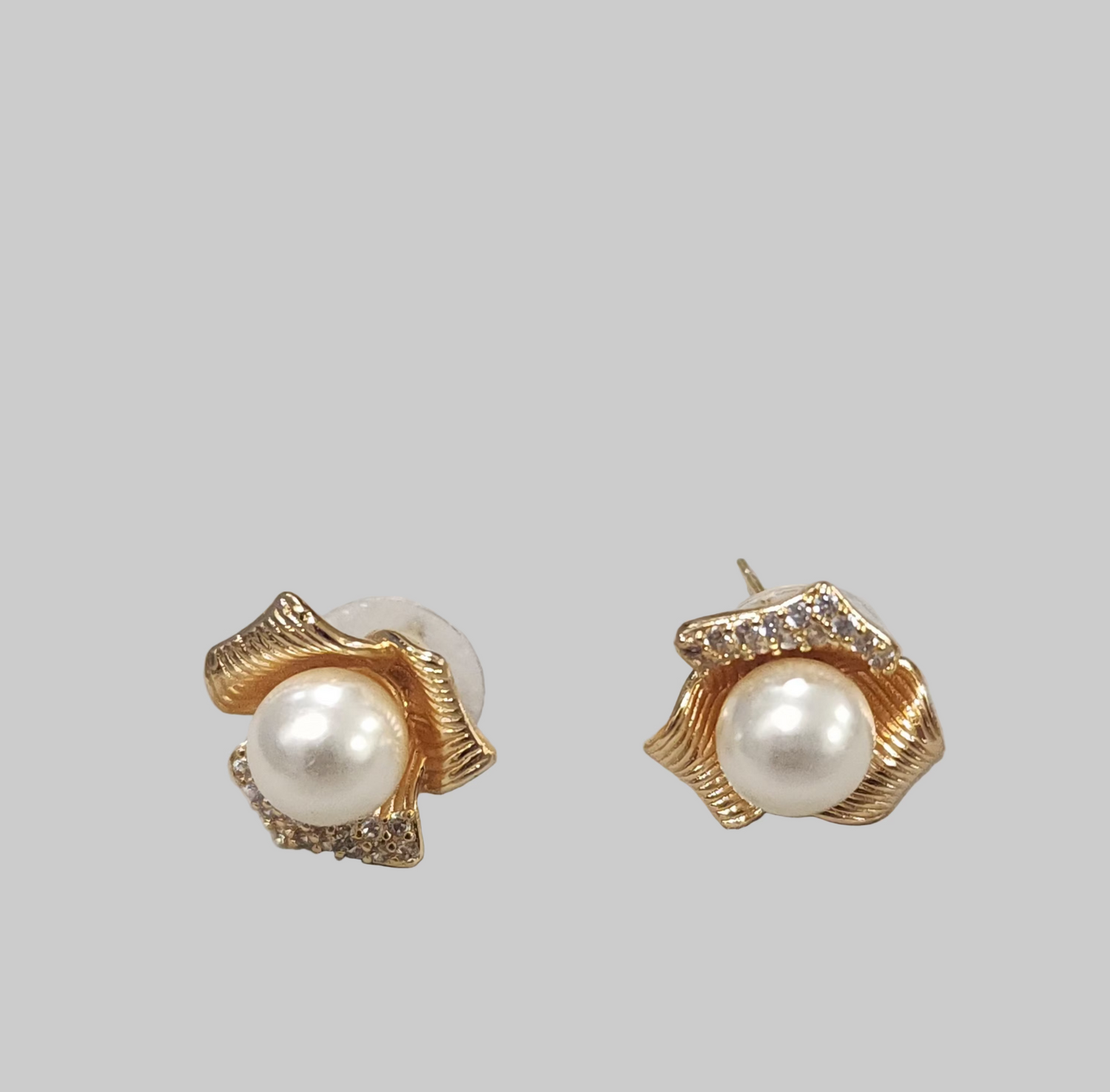 Rose Petal earrings with gold accents on a light gray background